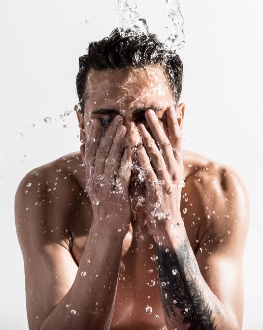 Man washing his face