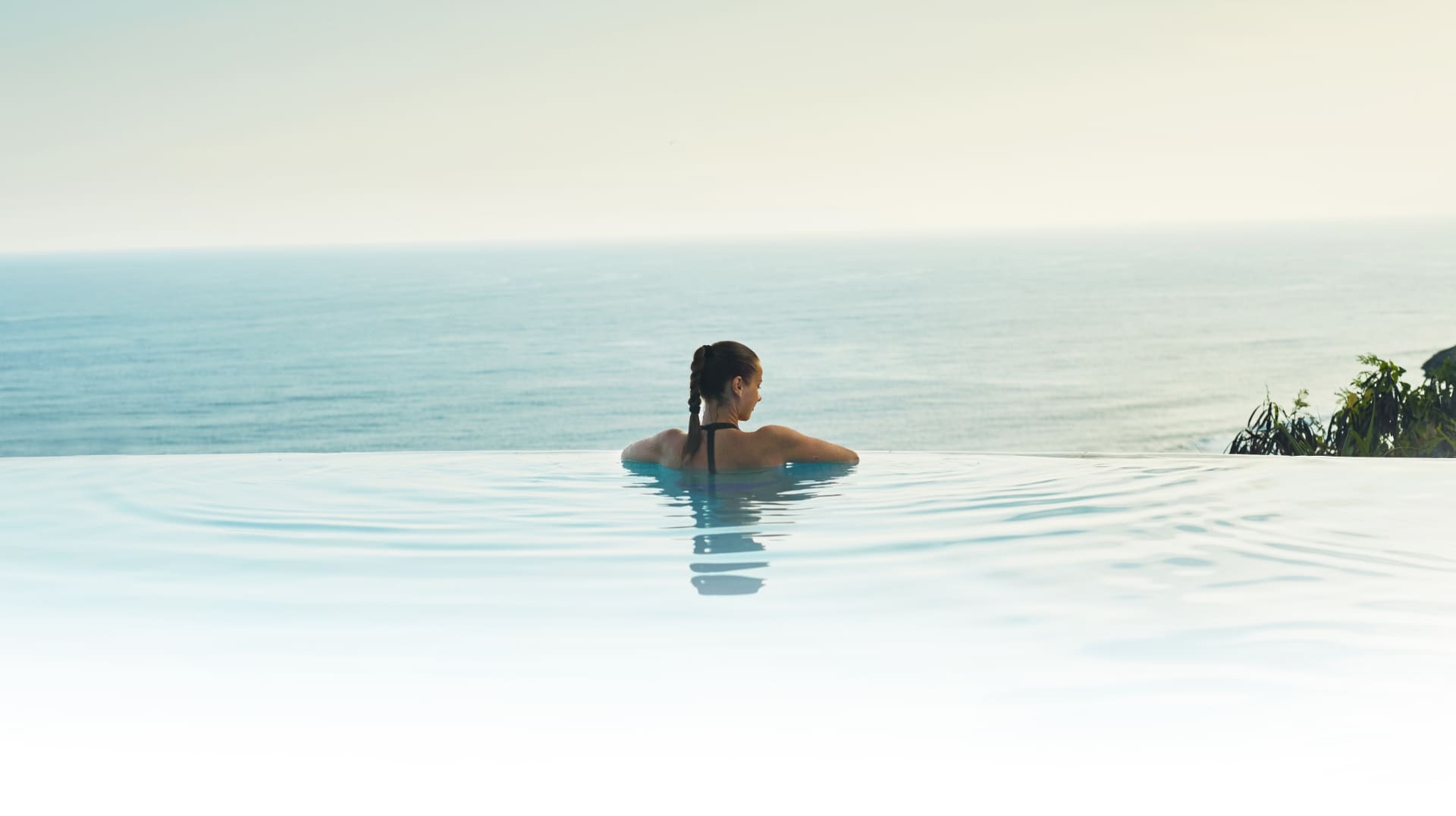 Woman in infinity pool