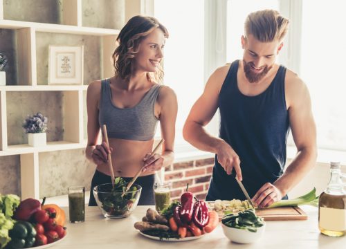 Man and woman cooking together in the kitchen