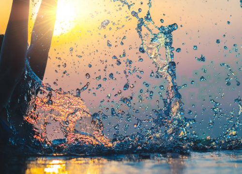 Photo of a woman splashing around in the ocean